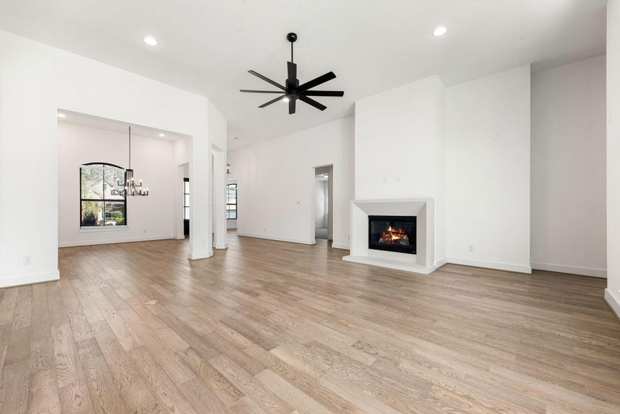 Family room with engineered wood flooring and fireplace