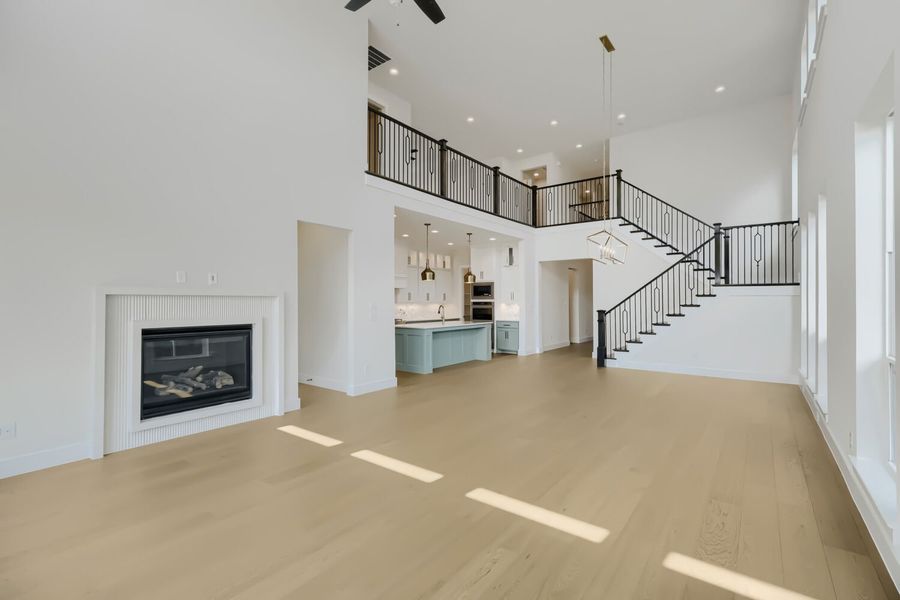 Plan 1543 Representative Photo - Living, Kitchen and Staircase
