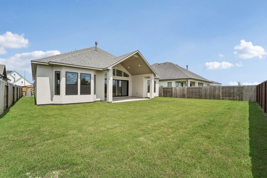 Exterior details and patio area of a home in Del Bello Lakes 60', Manvel (Image 4).