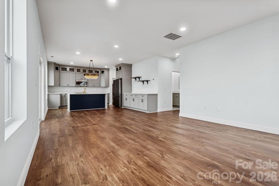 main living room offers open concept, recessed lighting, abundance of natural light and access to the rear deck