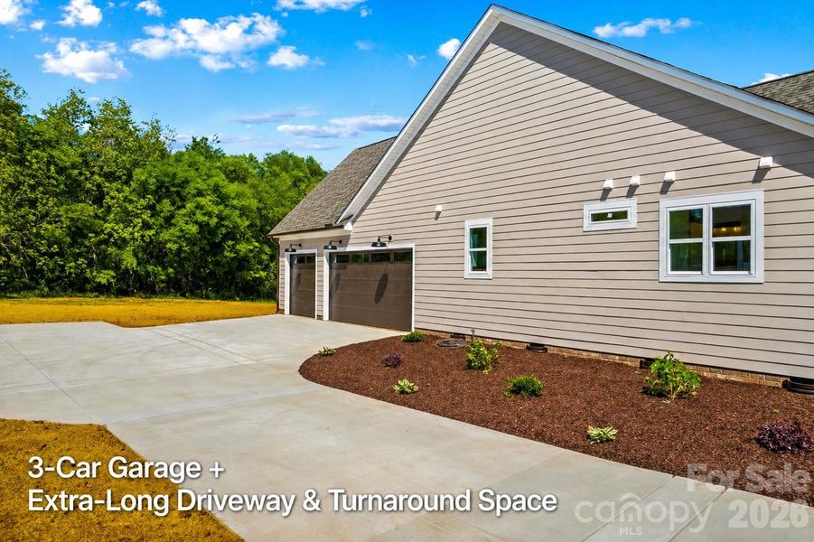 Wow! 3 Car Garage plus long double driveway with turn around area. (800 sf of Garages)