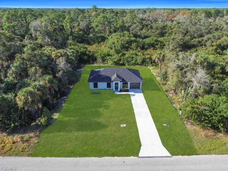 Front exterior of a new home in , Lehigh Acres, FL, highlighting curb appeal (Image 23).