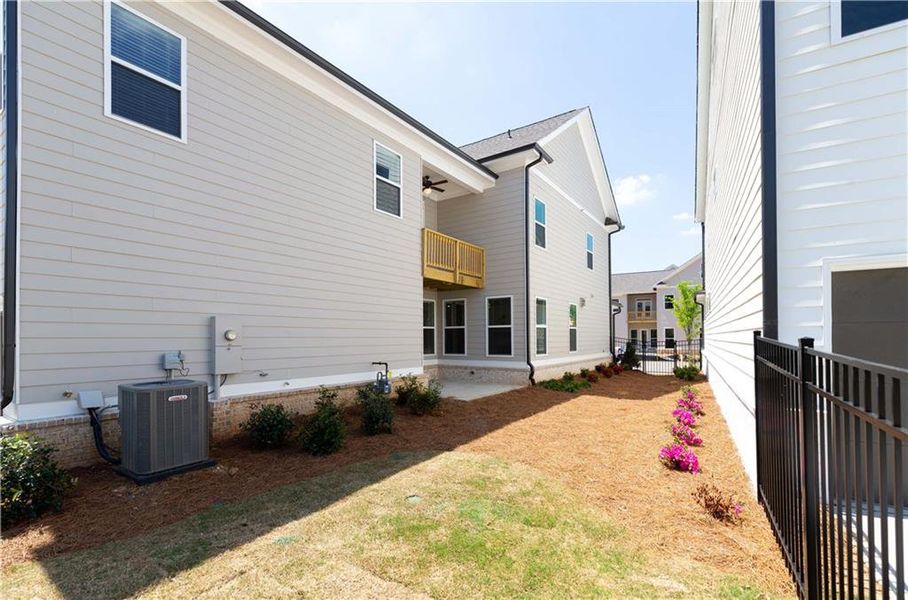 Exterior details and patio area of a home in Waterside Single Family, Peachtree Corners (Image 27).