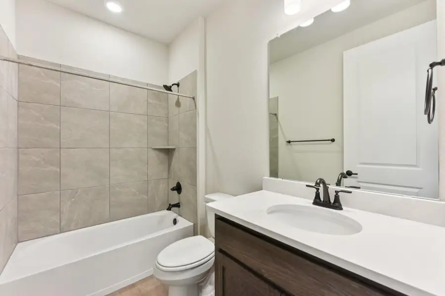 Full bath with shower / bath combination and vanity