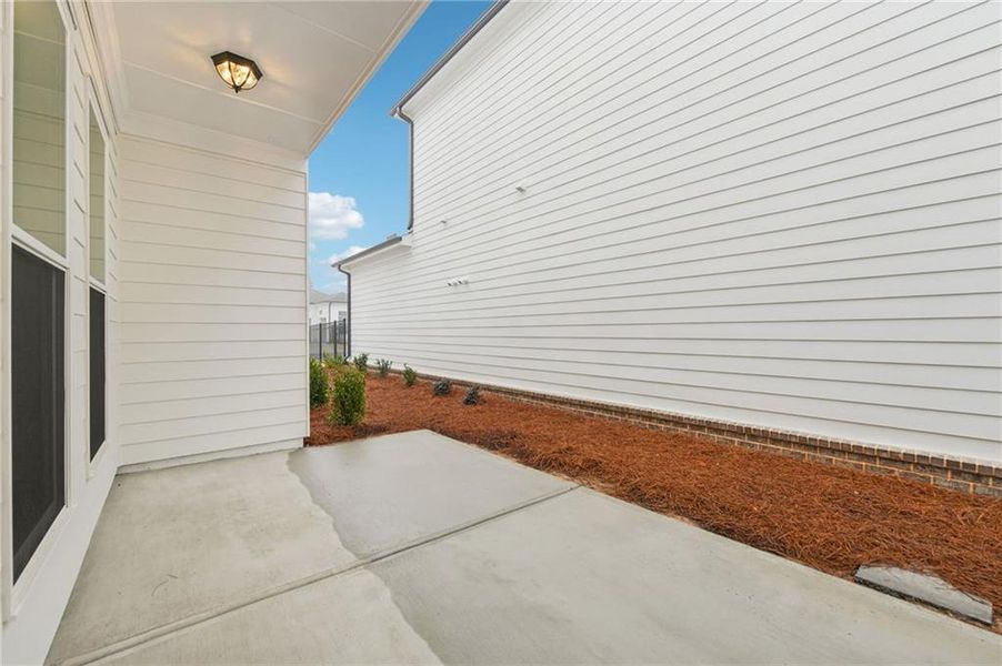 Exterior details and patio area of a home in Promenade at Sawnee Village, Cumming (Image 4).