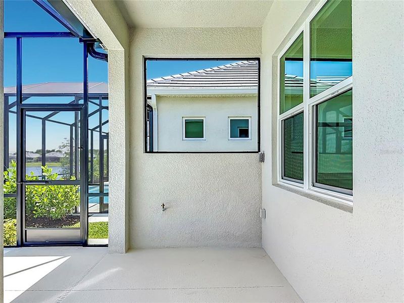 Exterior details and patio area of a home in Watercolor Place, Bradenton (Image 30).