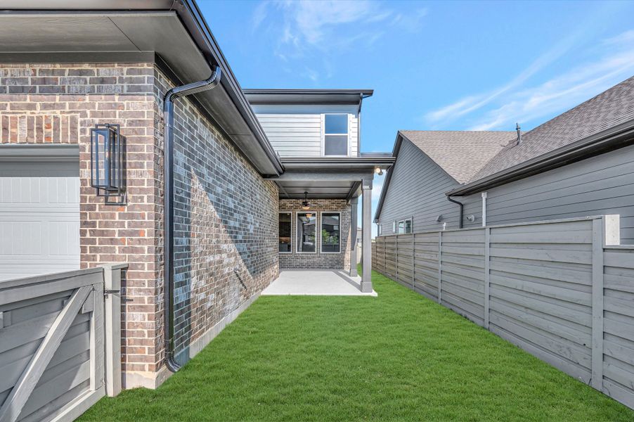 Exterior details and patio area of a home in Pomona - Grove Row Collection, Manvel (Image 3).