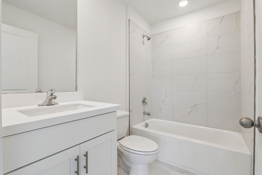 Representative furnished interior of a home built from the Clementine by Hartizen Homes in Eden Crest, Apopka (Image 13).