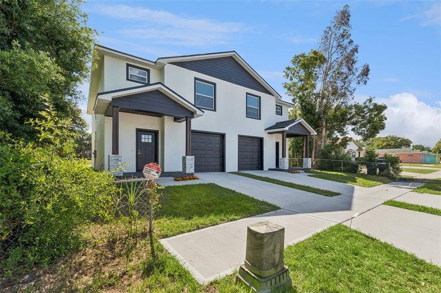 Front exterior of a new home in , Lakeland, FL, highlighting curb appeal (Image 23).