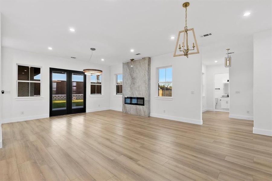 Double doors leading to covered back patio! Yet, ANOTHER living area!