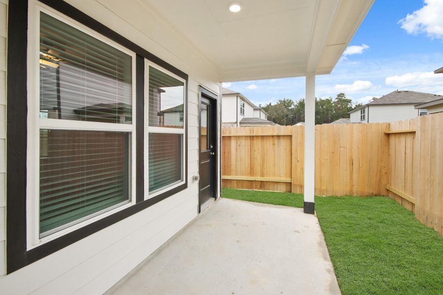 Exterior details and patio area of a home in Lakes at Black Oak, Magnolia (Image 4).