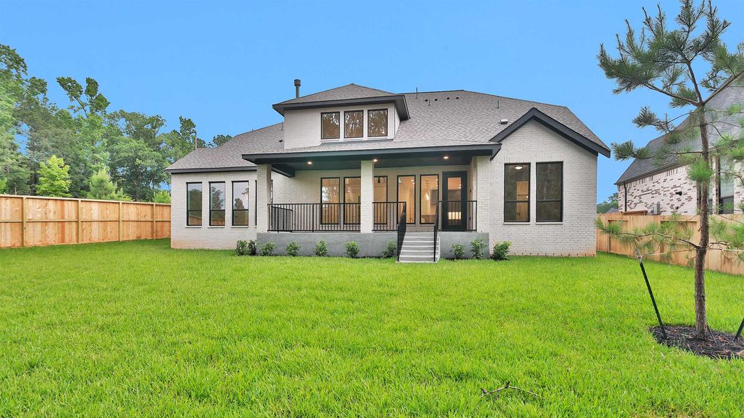 Exterior details and patio area of a home in The Woodlands Hills, Willis (Image 2).