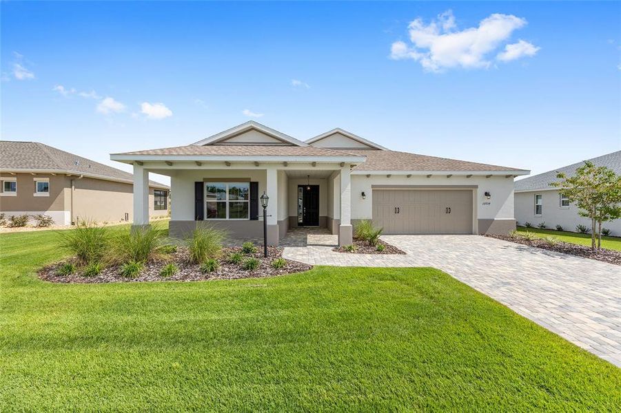 Front exterior of a new home in On Top of the World Communities, Ocala, FL, highlighting curb appeal (Image 20). Front exterior of a new home in On Top of the World Communities, Ocala, FL, highlighting curb appeal (Image 20).