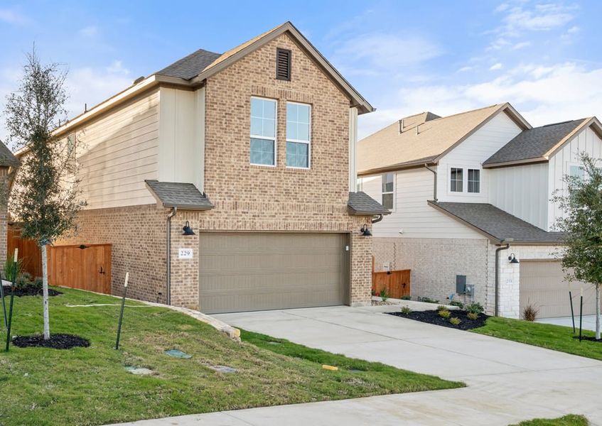 Front exterior of a new home in Terrace Collection at Lariat, Liberty Hill, TX, highlighting curb appeal (Image 23).