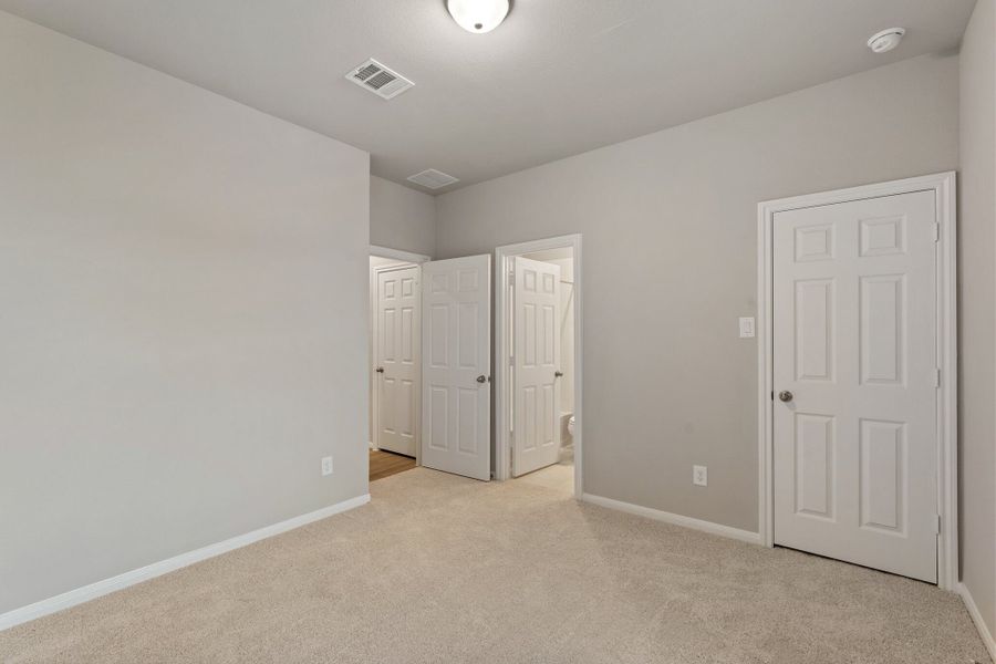 An additional view of the fourth bedroom, closet and private bath