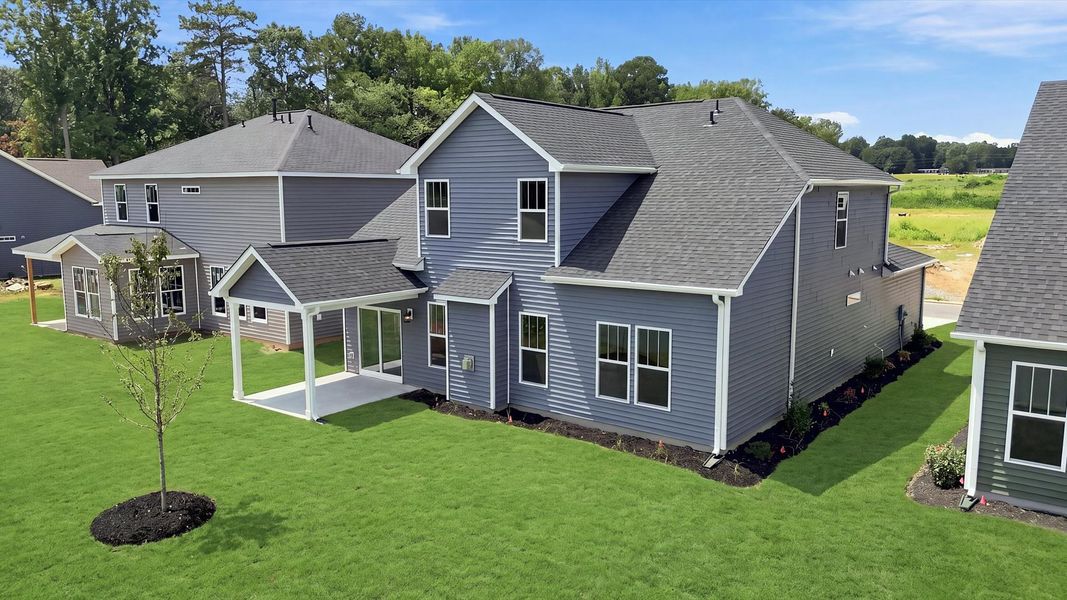 Vibrant rear outdoor space featuring a covered porch and exceptional craftsmanship located in Woodruff, SC Vibrant rear outdoor space featuring a covered porch and exceptional craftsmanship located in Woodruff, SC
