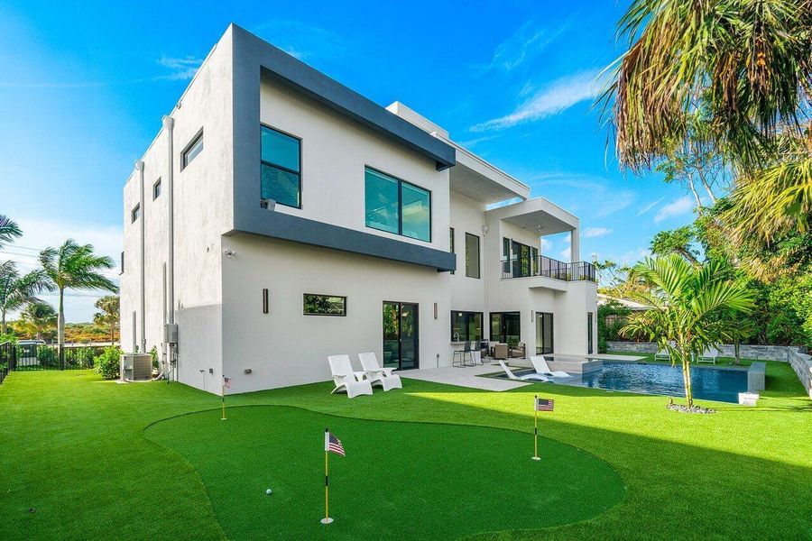 Front exterior of a new home in , Juno Beach, FL, highlighting curb appeal (Image 1).