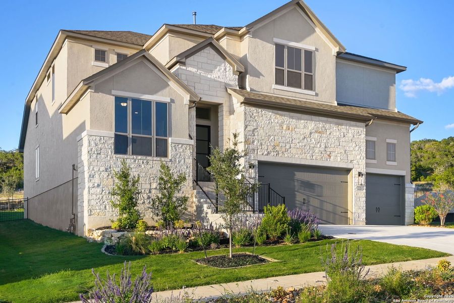 Front exterior of a new home in Esperanza - 70', Boerne, TX, highlighting curb appeal (Image 2). Front exterior of a new home in Esperanza - 70', Boerne, TX, highlighting curb appeal (Image 2).