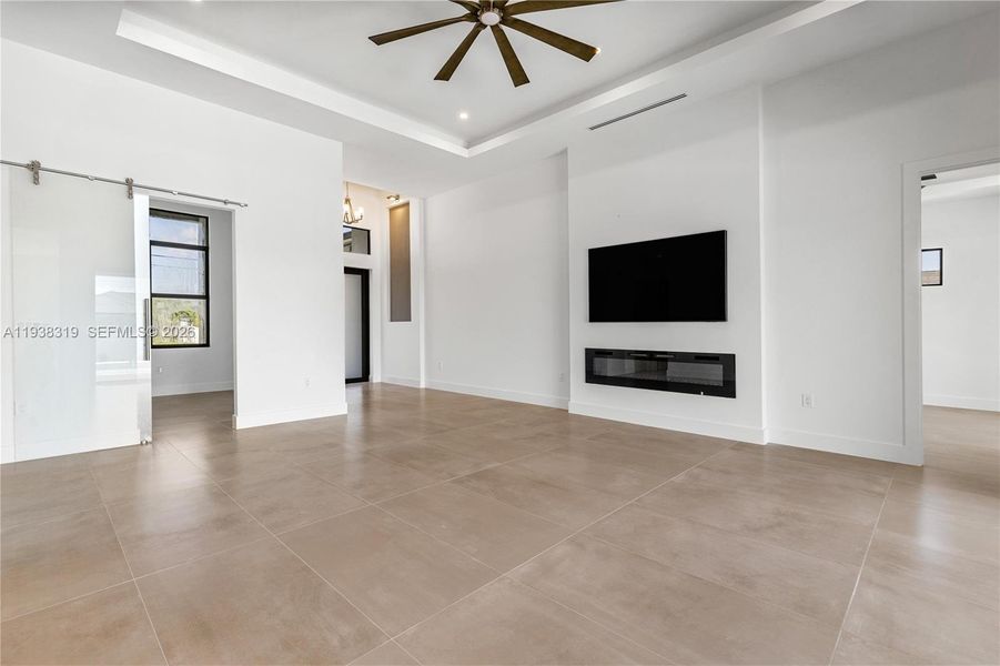 SPANISH PORCELAIN TILE flows throughout entire 2,420 sq ft layout, enhancing the HOME'S MODERN ELEGANCE and seamless continuity.