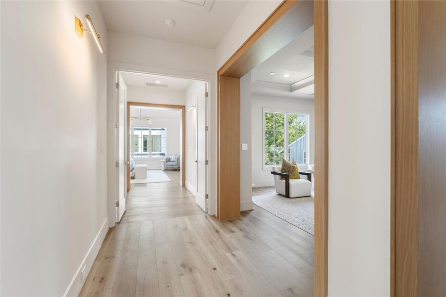 The upstairs landing branches off into four spacious bedrooms and and a media room. Fifty Seventh & 7th’s signature white oak door casings subtly separate the spaces and add personality to the interior. The selection of windows blankets the home in sunlight!