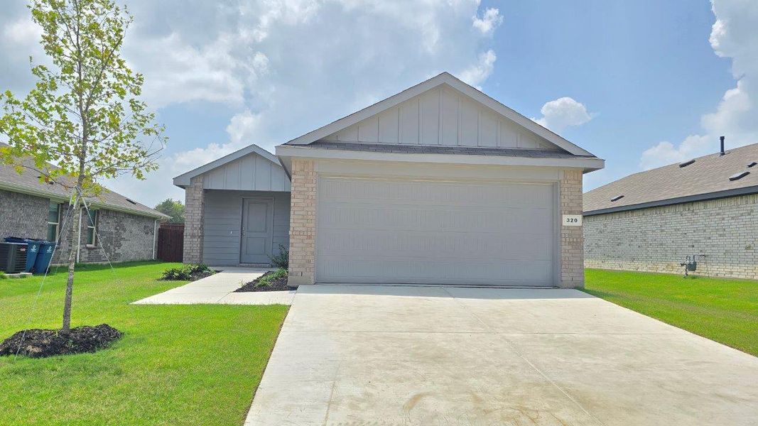 Front exterior of a new home in The Canyons, Keene, TX, highlighting curb appeal (Image 1). Front exterior of a new home in The Canyons, Keene, TX, highlighting curb appeal (Image 1).