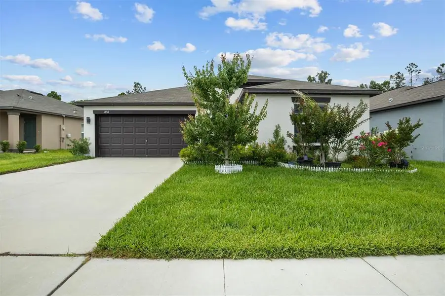 Front exterior of a new home in , Lakeland, FL, highlighting curb appeal (Image 2). Front exterior of a new home in , Lakeland, FL, highlighting curb appeal (Image 2).