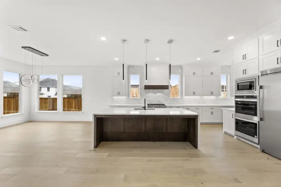 Representative furnished interior of a home built from the 6051 by Tradition Homes in Mustang Lakes, McKinney (Image 4).