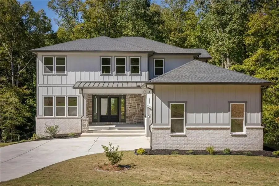 Front exterior of a new home in , Snellville, GA, highlighting curb appeal (Image 1). Front exterior of a new home in , Snellville, GA, highlighting curb appeal (Image 1).