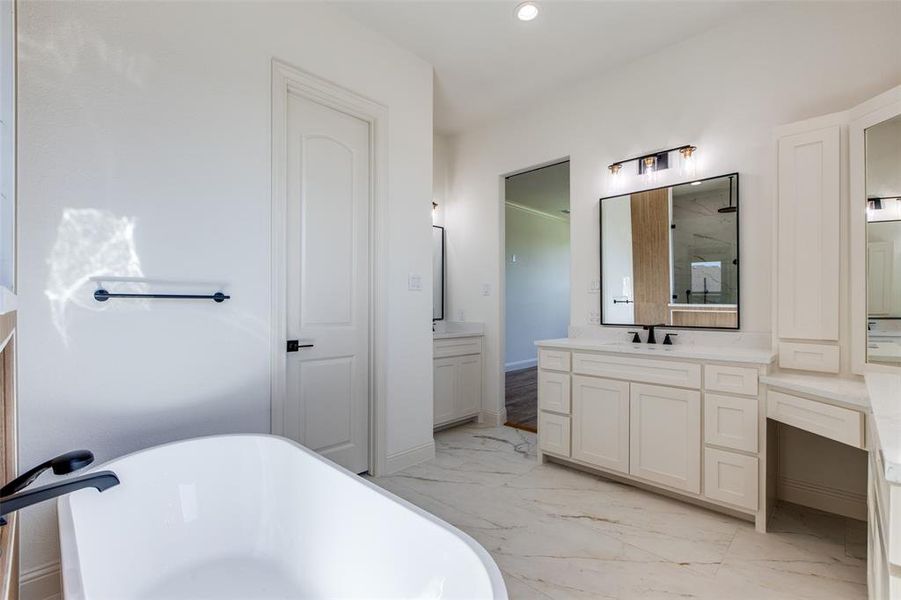 Bathroom with vanity and plus walk in shower