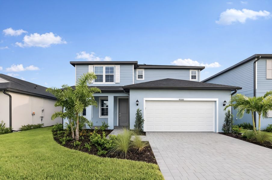 Front exterior of a new home in Sabal Glen at Babcock Ranch, Punta Gorda, FL, highlighting curb appeal (Image 1). Front exterior of a new home in Sabal Glen at Babcock Ranch, Punta Gorda, FL, highlighting curb appeal (Image 1).