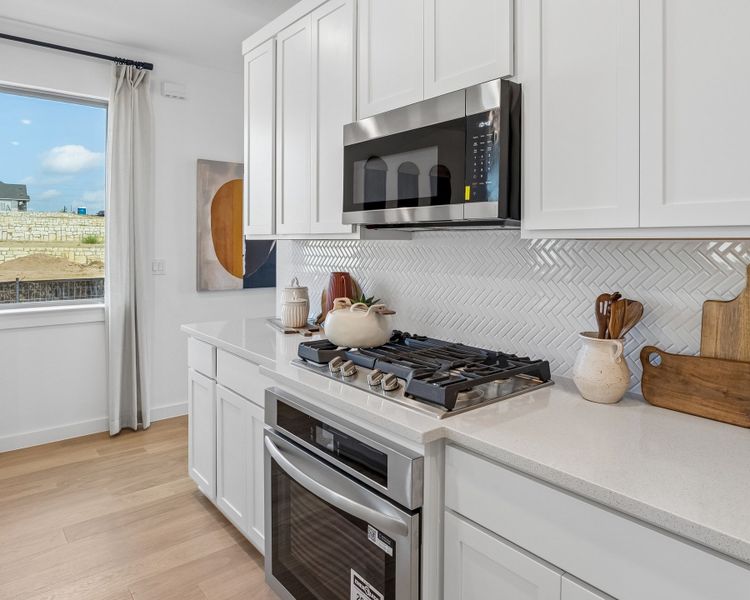 Kitchen in the Magnolia home plan by Trophy Signature Homes – REPRESENTATIVE PHOTO Kitchen in the Magnolia home plan by Trophy Signature Homes – REPRESENTATIVE PHOTO