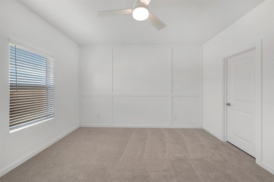 Private primary suite with feature wall
