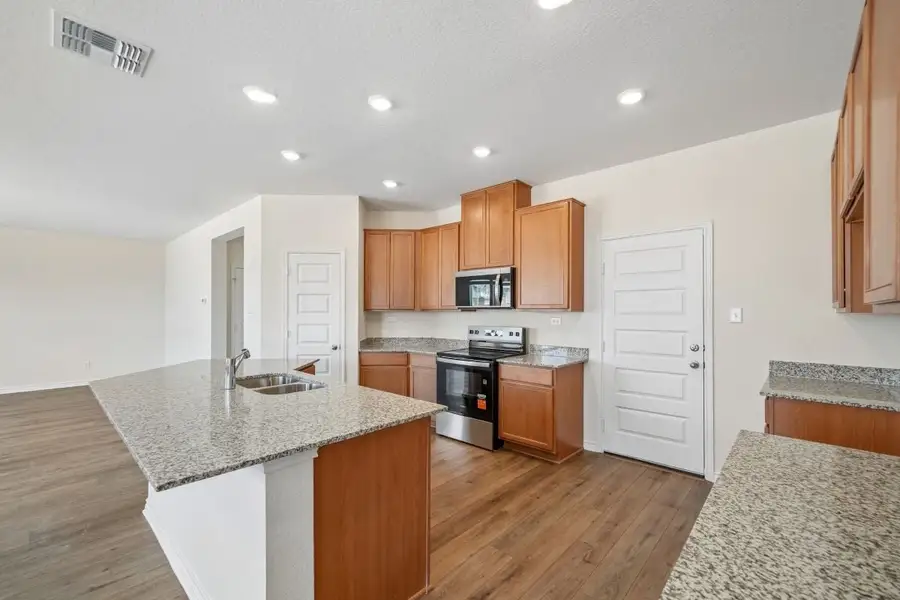 Furnished interior view inside a new home in Preserve at Culebra - Sterling Collection, San Antonio (Image 5).
