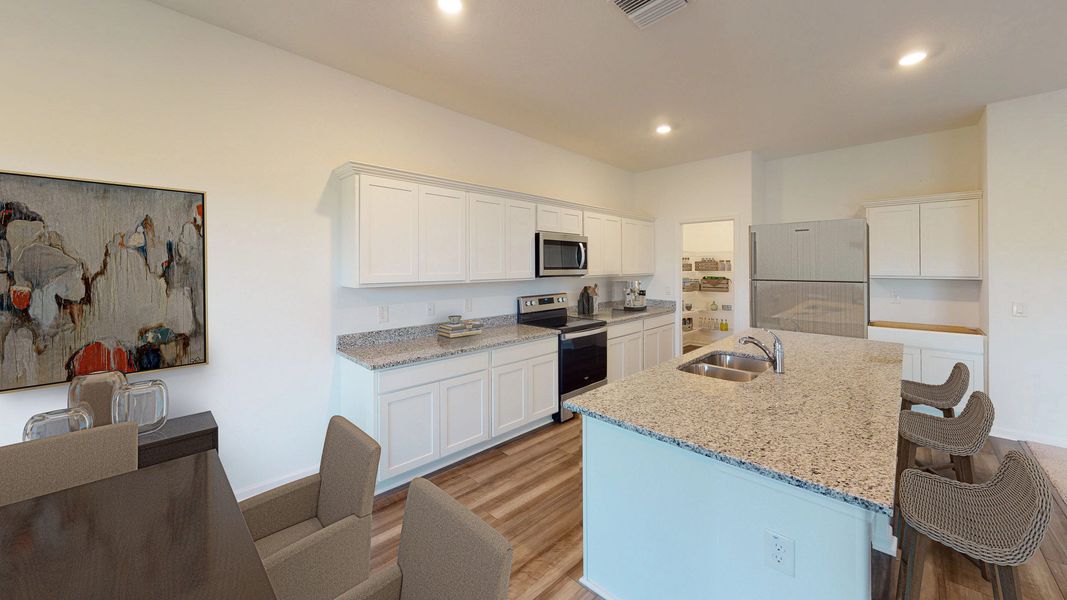 Representative furnished interior of a home built from the Europa by Starlight Homes in Oakfield Lakes, Parrish (Image 3).