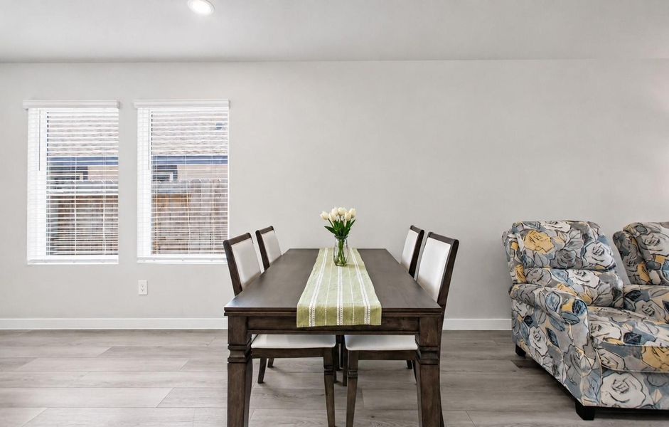 A bright dining space is conveniently located just off the kitchen and living area, making it easy to spend time with family and friends. A bright dining space is conveniently located just off the kitchen and living area, making it easy to spend time with family and friends.