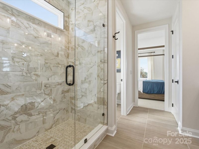 Frameless Walk-In Shower with Modern Tile Design. *Model Photos | Actual Finishes, Structural Selections, and Orientation May Vary. Frameless Walk-In Shower with Modern Tile Design. *Model Photos | Actual Finishes, Structural Selections, and Orientation May Vary.