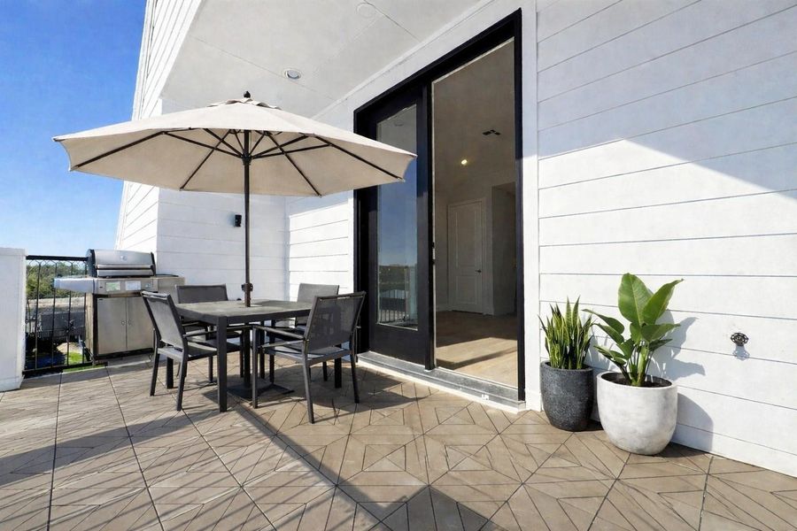 Private rooftop terrace off the third-floor game room! Virtual staging added.
