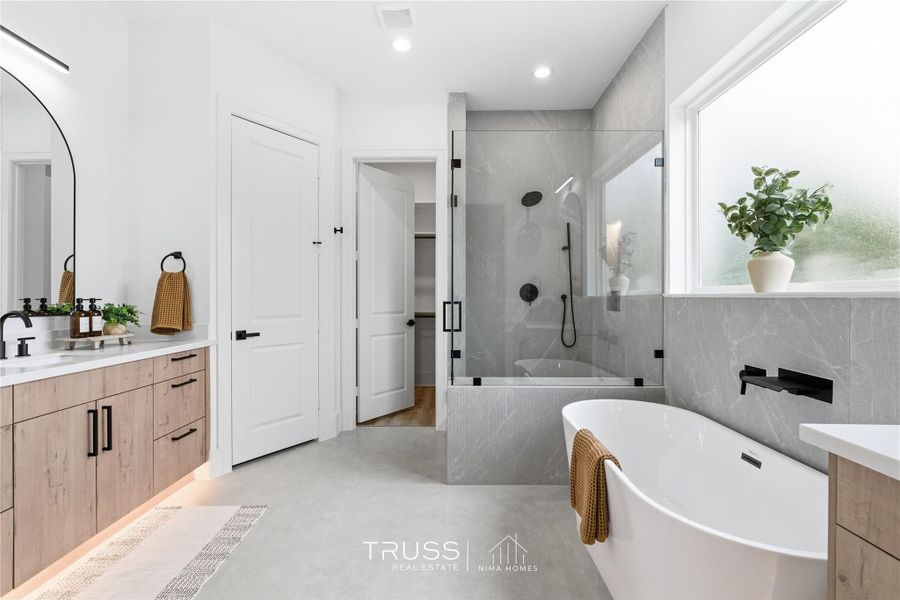 Sleek glass and precision tilework create a modern sanctuary where every line and surface feels intentional.