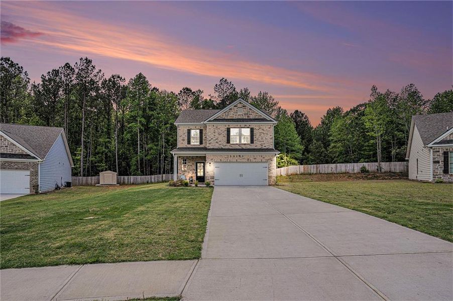 Front exterior of a new home in Vineyard Park, Griffin, GA, highlighting curb appeal (Image 25). Front exterior of a new home in Vineyard Park, Griffin, GA, highlighting curb appeal (Image 25).