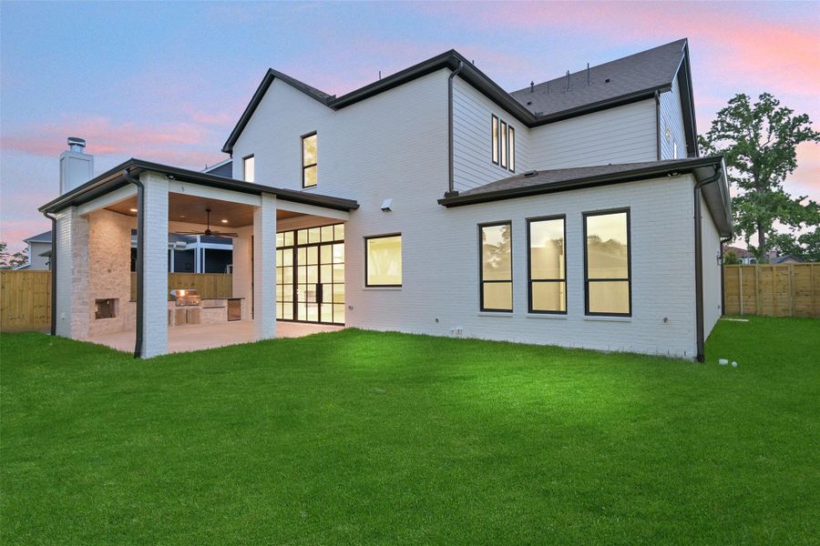 Sample of builder's previous construction. This new construction will have a similar back elevation as pictured here. There will be a large backyard green space offering lots of room for kids/pets to play. Pool-sized backyard; buyer to verify.