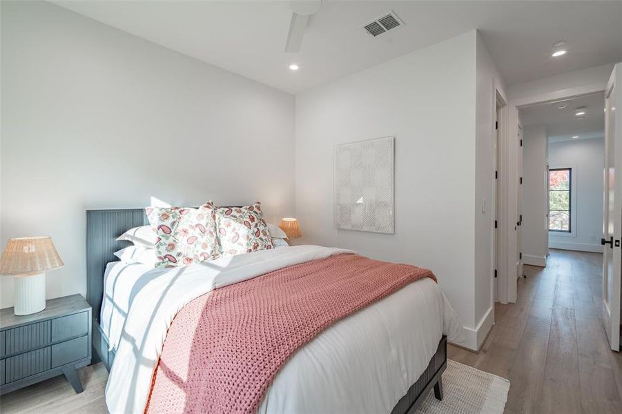 Bedroom featuring ceiling fan and light hardwood / wood-style floors