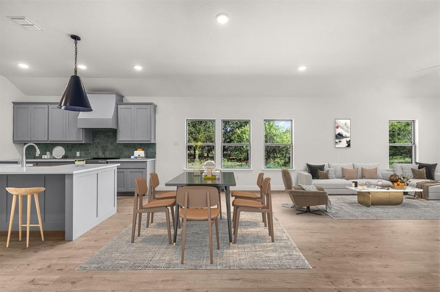 Virtually staged dining space with recessed lighting, light style floors, and plenty of natural light
