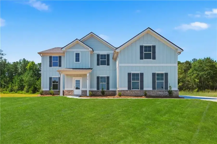 Front exterior of a new home in Brighton, Locust Grove, GA, highlighting curb appeal (Image 18).