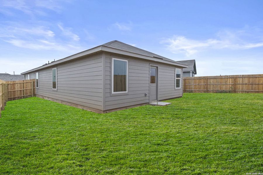 Exterior details and patio area of a home in Spring Grove, St. Hedwig (Image 16).