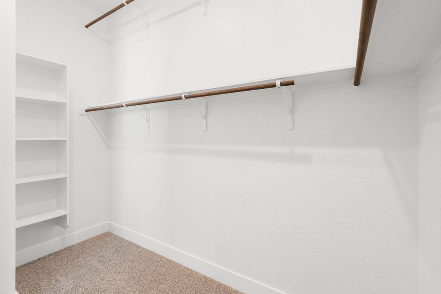 Ample shelving and hanging space defines this organized closet, ready for personalized storage solutions.