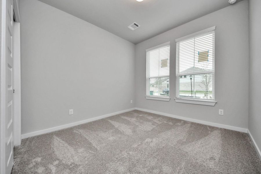 Secondary Bedroom. Sample photo of completed home with similar floor plan. Actual colors and selections may vary.