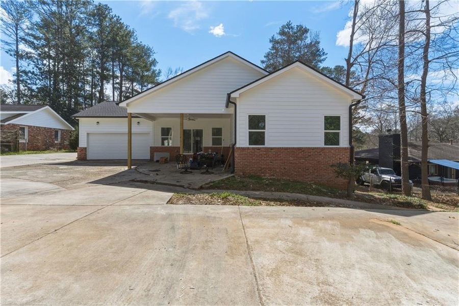 Front exterior of a new home in , East Point, GA, highlighting curb appeal (Image 1). Front exterior of a new home in , East Point, GA, highlighting curb appeal (Image 1).