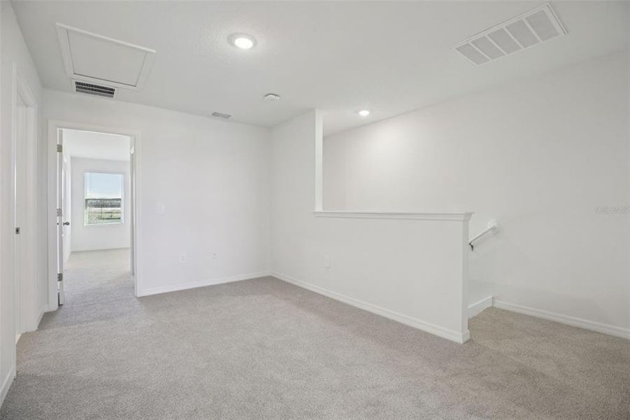 Spacious, unfurnished interior of a new home in The Reserve at Hammock Oaks Townes, Lady Lake (Image 38).