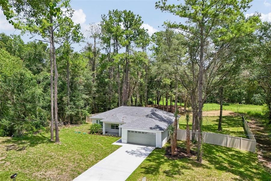 Front exterior of a new home in , Citrus Springs, FL, highlighting curb appeal (Image 29). Front exterior of a new home in , Citrus Springs, FL, highlighting curb appeal (Image 29).