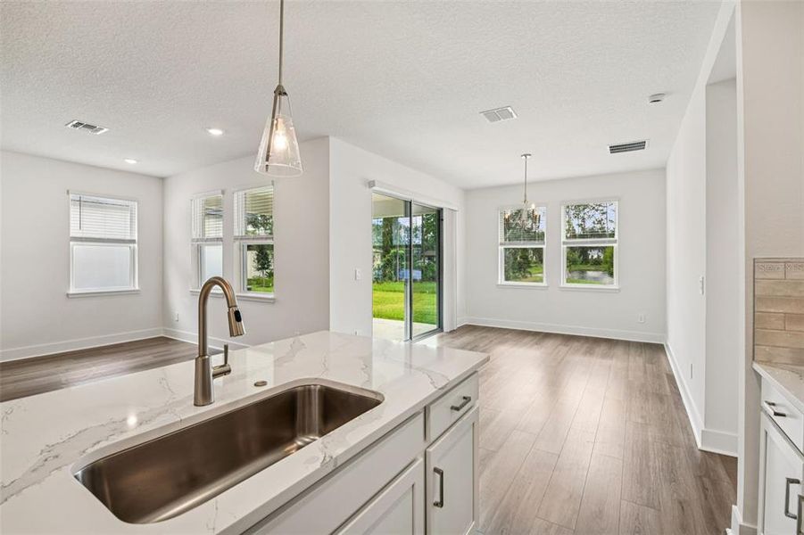 Furnished interior view inside a new home in Legends Preserve - Signature Series, Daytona Beach (Image 10).